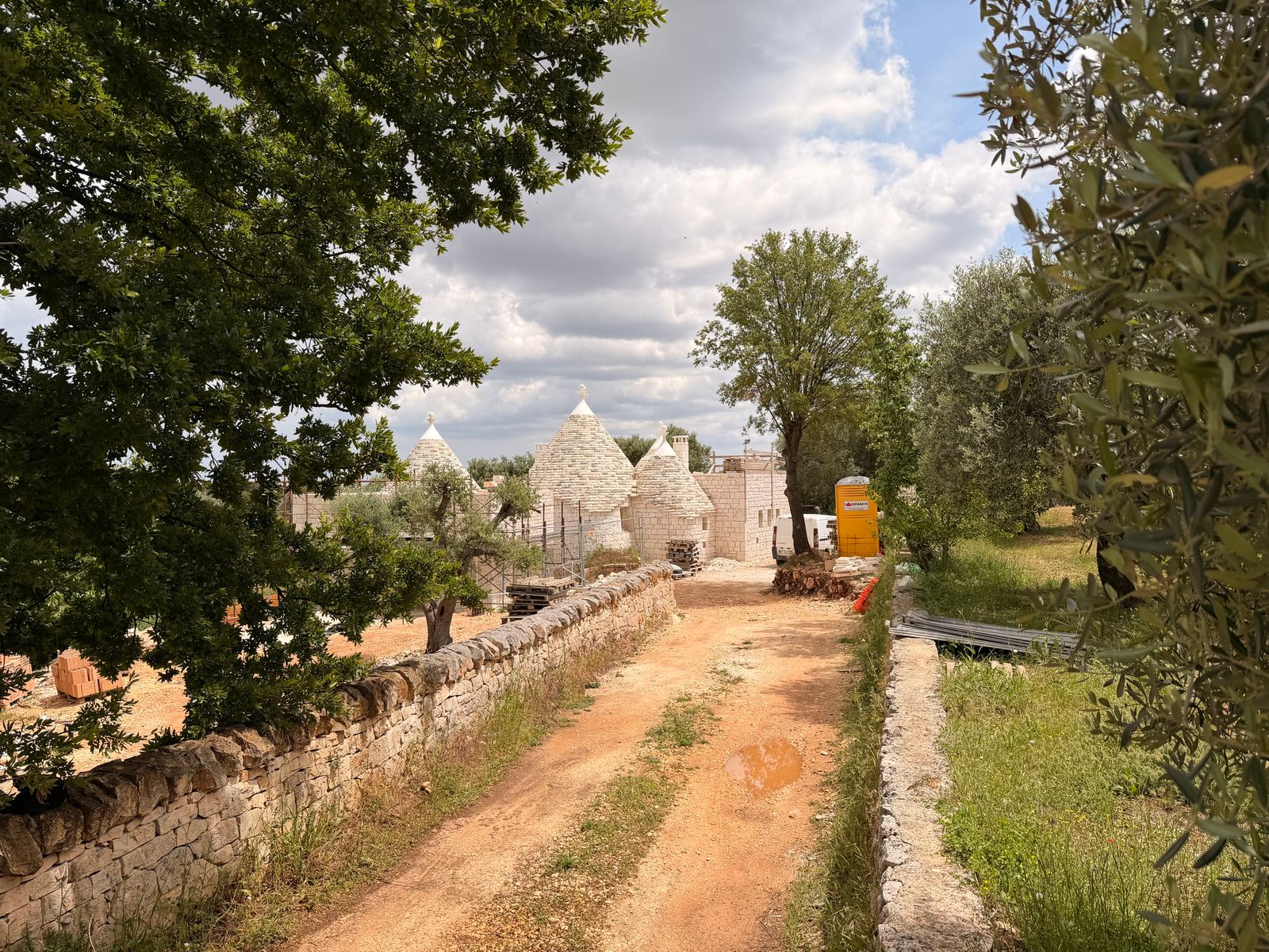 The earthen track leading to the stone buildings of the estate